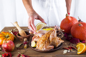 woman holding a plate with chicken