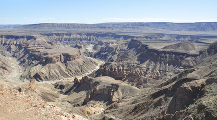Fototapeta na wymiar Fish River canyon in Namibia; the Grand Canyon of Africa. Deep gorges.