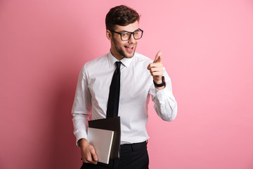Portrait of a joyful young man in white shirt