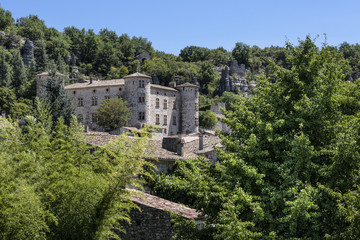 France, Vogue, river Ardeche: Skyline with ancient stone castle and homes of the medieval town.