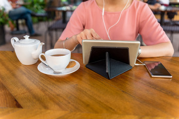 Woman using tablet and surfing information