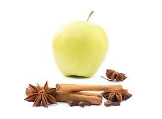 Aromatic apple, star anise, cloves and cinnamon isolated on white background