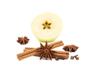 Aromatic apple, star anise, cloves and cinnamon isolated on white background