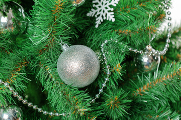 Christmas tree with ornaments, close-up