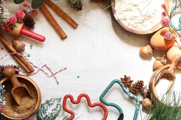 Xmas Holiday  background -Christmas baking ingredients with flour eggs spices and ornaments