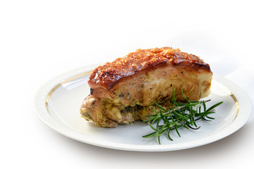 roast pork loin with crust and rosemary garnish on a fine plate, background fades to white, copy space