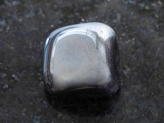 polished hematite stone on dark background