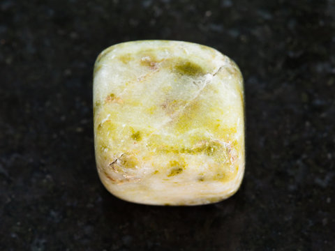 polished agate gem stone on dark background