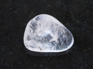 polished Rock-crystal gem stone on dark