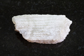 raw Talc stone on dark background