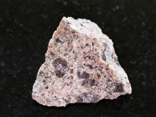 raw Granite stone on dark granite background