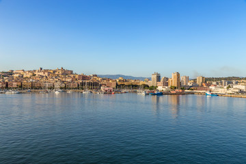 Cagliari, Sardinia, Italy. View of city and port from the sea at sunset