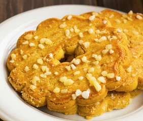 Cookies biscuits with sugar flakes, festive milk biscuits in a plate