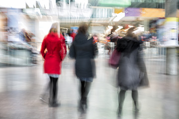 Intentional blurred image of people walking