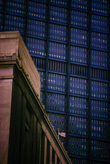 Corporate buildings overshadowing American flag