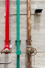 Pipes on concrete wall