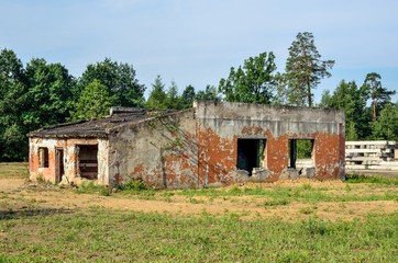 Fototapeta na wymiar Old demolished building. An abandoned military unit building.