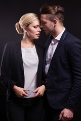 Picture of attractive couple of office workers standing