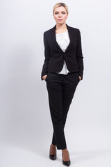 Attractive business lady in strong office jacket