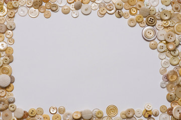 Clothes vintage buttons on white background with copyspace