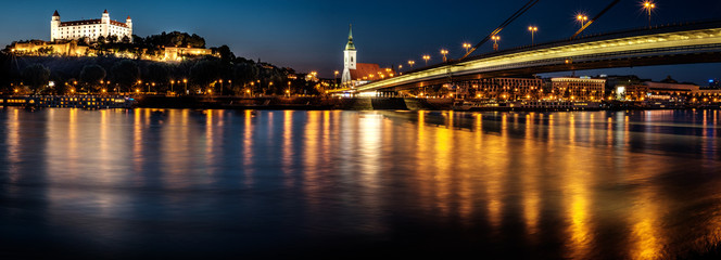 Fototapeta na wymiar Bratislava castle,Parliament and the New bridge over Danube river with evening lights in capital city of Slovakia,Bratislava