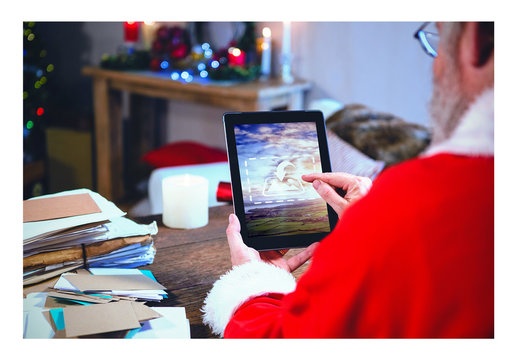 Santa Using Tablet with Stack of Letters Mockup