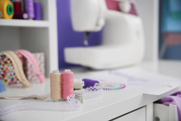 Different tailor accessories on table