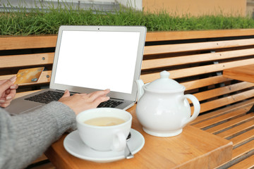 Young woman using laptop at table