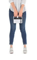 Naklejka premium Woman holding radio on white background