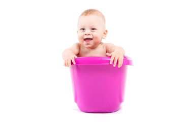happy cute baby boy take bath in tub