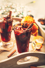 Hot wine aroma drink with spices in tall glasses