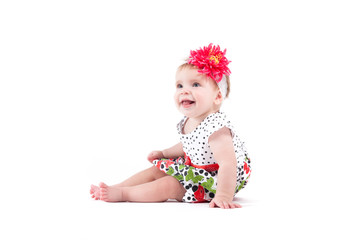 cute cheerful little girl in dress and wrap