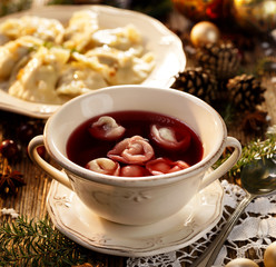 Christmas beetroot soup, borsch with small dumplings with mushrooms stuffing, traditional Christmas eve dish in Poland