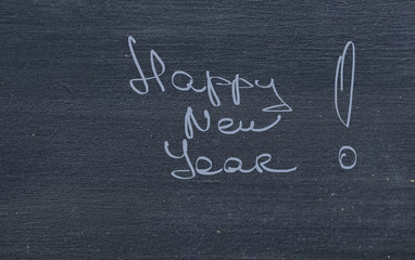 Happy New Year Greetings on Chalkboard