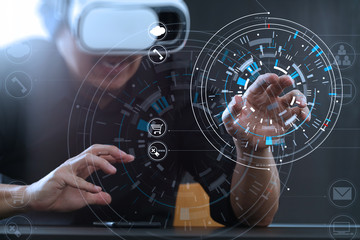businessman wearing virtual reality goggles in modern office with Smartphone using with VR headset with scanning data screen icon diagram