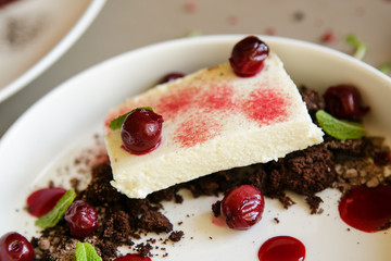 cake with cherries on background