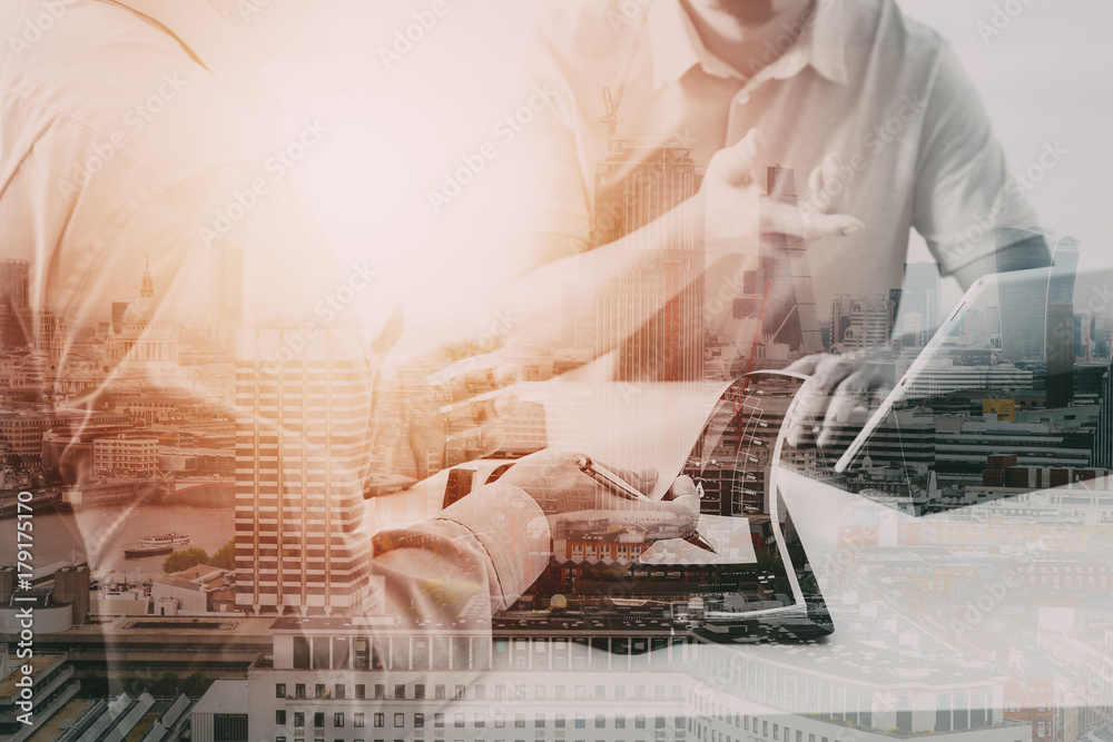 Poster Businessmen working together on a document and using smart phone and digital tablet and laptop computer in modern office with VR icon diagram