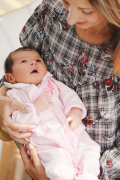 young mother with cute newborn baby