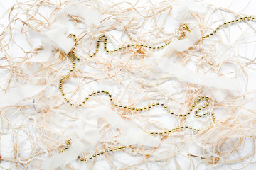 calligraphy words happy holidays and christmas tinsel decoration. flat lay, top view