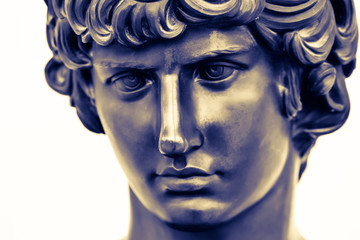 Ancient male statue of Mercury of 18th century isolated on white background. Public domain. Beautiful face closely. Greek god Hermes of speed for design, posters, prints, art calendar. Bronze statue.