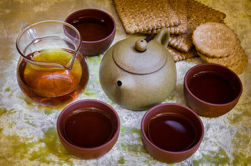 Evening tea ceremony. Kettle, cookies, tea drinks