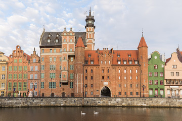 Fototapeta na wymiar View of old buildings along the Long Bridge waterfront at the Main Town in Gdansk, Poland, in the daytime.