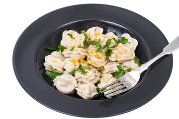 Boiled dumplings in plate on white background