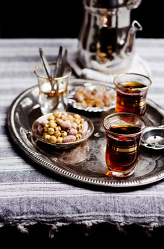 Turkish tea, nibbles and sugar on a tray