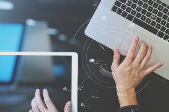 cyber security internet and networking concept.Businessman hand working with VR screen padlock icon on laptop computer and digital tablet background