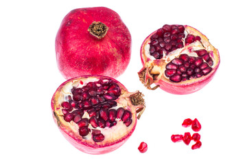 Ripe red pomegranates on white background