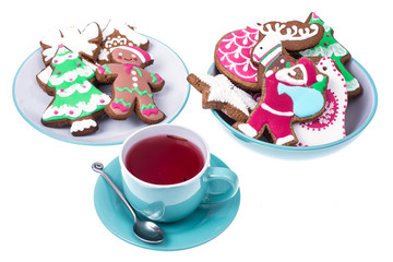 Cup of red tea with gingerbread Christmas gingerbread