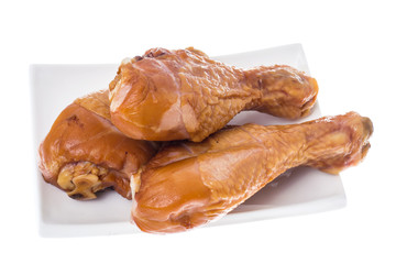 Smoked chicken pieces on white background