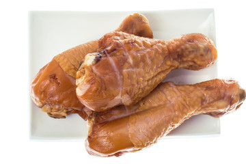 Smoked chicken pieces on white background