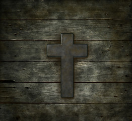 christian cross on old wooden plank